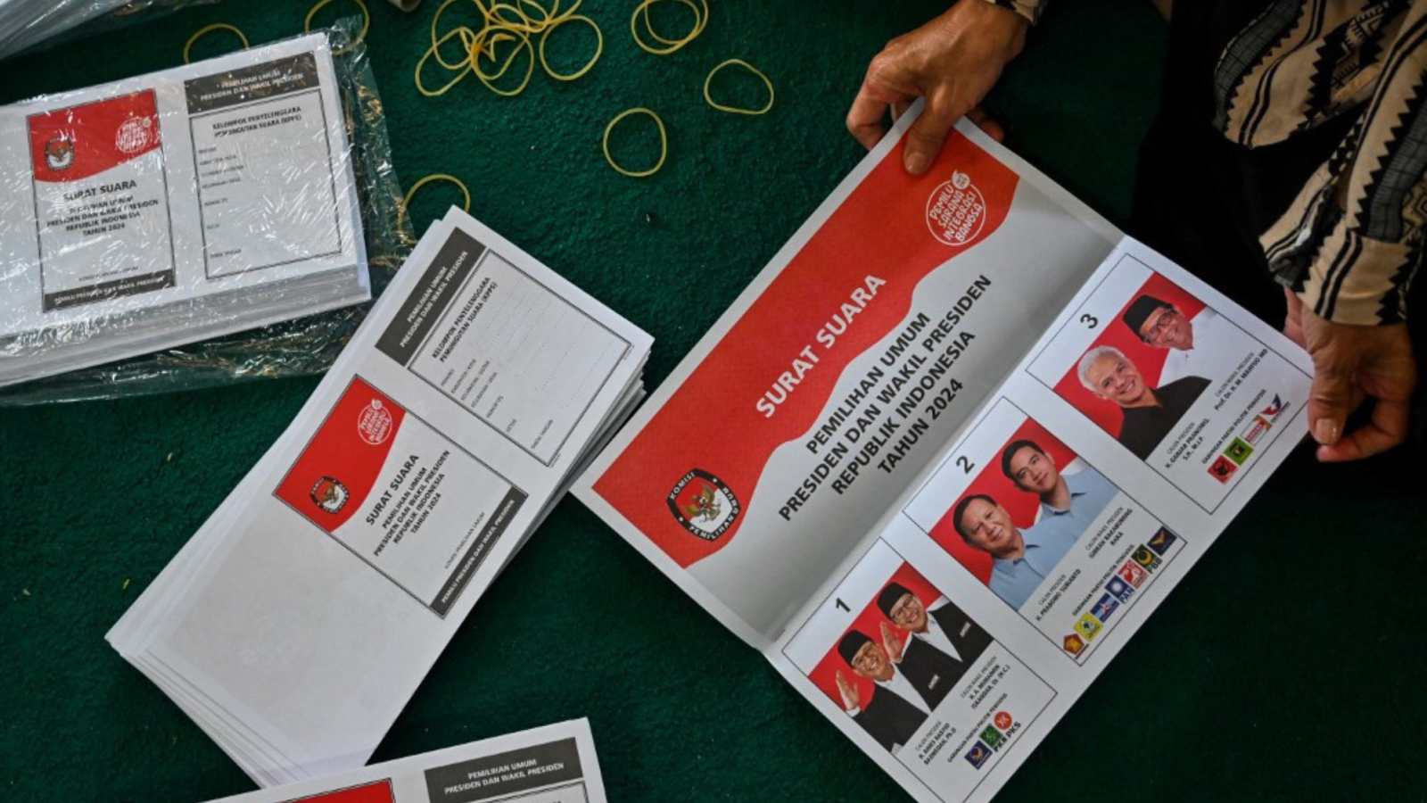 Pictured are the ballot papers for the presidential election during the folding and sorting process. Photo Credit Chaideer Mahyuddin, Associated Free Press.