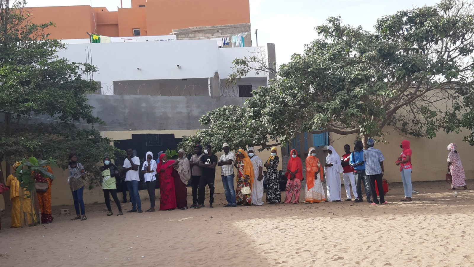 Voters stand in line waiting their turn to vote in the 2022 Senegalese local elections