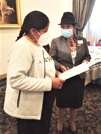 During a facilitated activity, two participants share ideas about what it means to be a leader as a woman in Quito, Ecuador